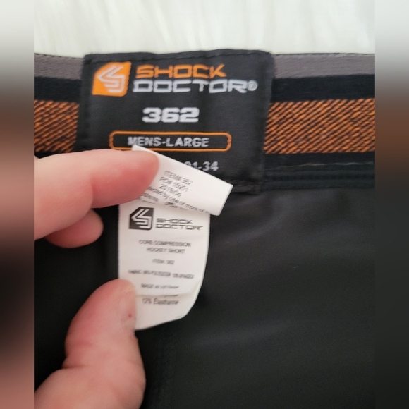 Shock Doctor Black and Orange Hockey Shorts, Size Large (28) - Picture 4 of 6